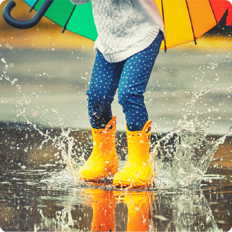 Picture of Girl Jumping in a Puddle